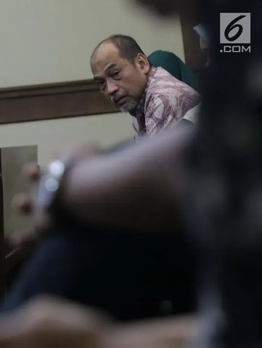 Terdakwa kasus suap dana hibah Kemenpora pada KONI yang juga Deputi IV Kemenpora Mulyana usai mengikuti sidang pembacaan pledoi di Pengadilan Tipikor, Jakarta, Kamis (29/8/2019). Sebelumnya, JPU KPK menuntut Mulyana dengan hukuman 7 tahun dan denda Rp200 juta. (Liputan6.com/Helmi Fithriansyah)