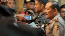 Kapolri Badrodin Haiti memberikan keterangan kepada beberapa awak media usai mengikuti rapat koordinasi terkait HAM di Gedung Kejaksaan Agung, Jakarta, Kamis (21/5/2015). (Liputan6.com/Andrian M Tunay)