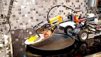 Dalam sebuah unggahan di situs pemutar video, akun The Brick Wall menunjukkan sebuah robot pembuat sarapan yang dibuat dari batangan Lego (Capture/The Brick Wall)