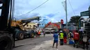 Petugas penyelamat terlihat di lokasi bangunan yang runtuh setelah gempa bumi melanda Port Vila, ibu kota Vanuatu, pada 18 Desember 2024. (Foto oleh STRINGER/AFP)
