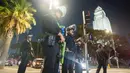 Penerapan jam malam menyusul gelombang demonstrasi menolak kebijakan imigrasi dari Presiden Amerika Serikat (AS) Donald Trump yang terus meluas. (RINGO CHIU/AFP)