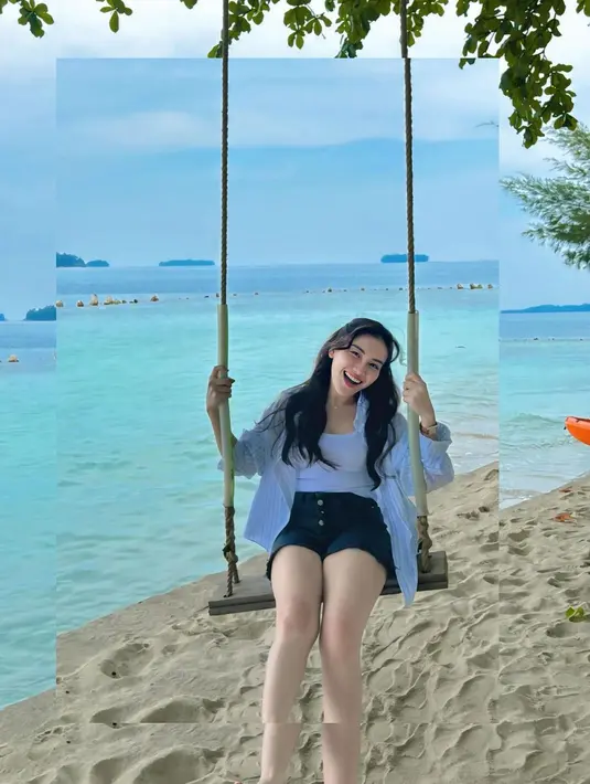 Seperti dalam foto, Ayu Ting Ting memadukan tank top dan kemeja putihnya dengan celana pendek warna hitam.  [@ayutingting92].