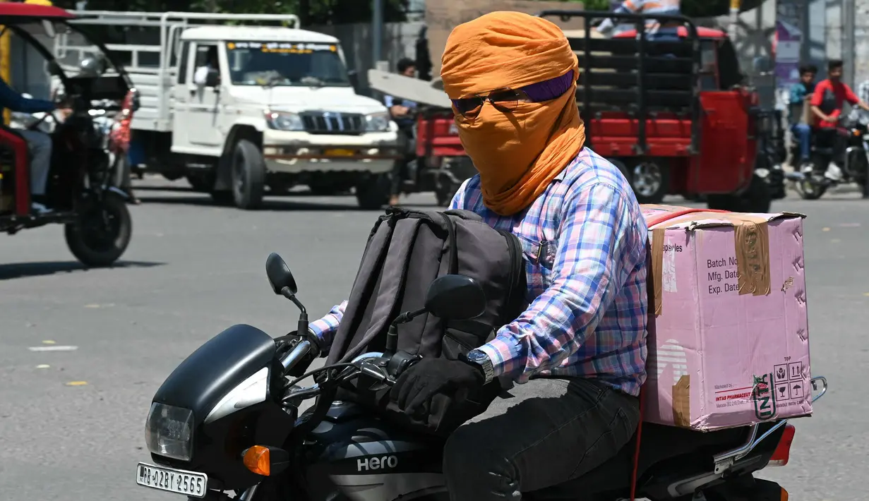 Sebuah penelitian ilmiah ekstensif menemukan bahwa perubahan iklim menyebabkan gelombang panas menjadi lebih lama, lebih sering dan lebih intens. (Narinder NANU/AFP)