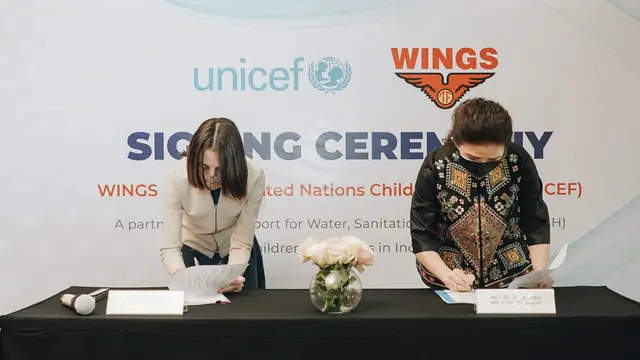 tanda tangan wings dan unicef 1