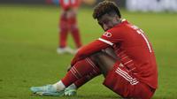 Pemain Bayern Munchen, Kingsley Coman, tampak lesu setelah ditaklukkan Manchester City pada babak perempat final leg kedua Liga Champions di Allianz Arena, Kamis (20/4/2023). (AP Photo/Matthias Schrader)