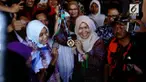 Usai meraih emas dan perak dalam Asian Games Atlet panjat tebing putri Puji Lestari disambut meriah oleh warga Marunda kampung asal Puji.