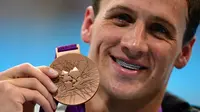 Pada London 2012, Ryan Lochte kembali memberikan AS dua medali emas. Keduanya diraih Lochte dari nomor 400m gaya ganti dan 4x200m gaya bebas. (AFP/Martin Bureau)