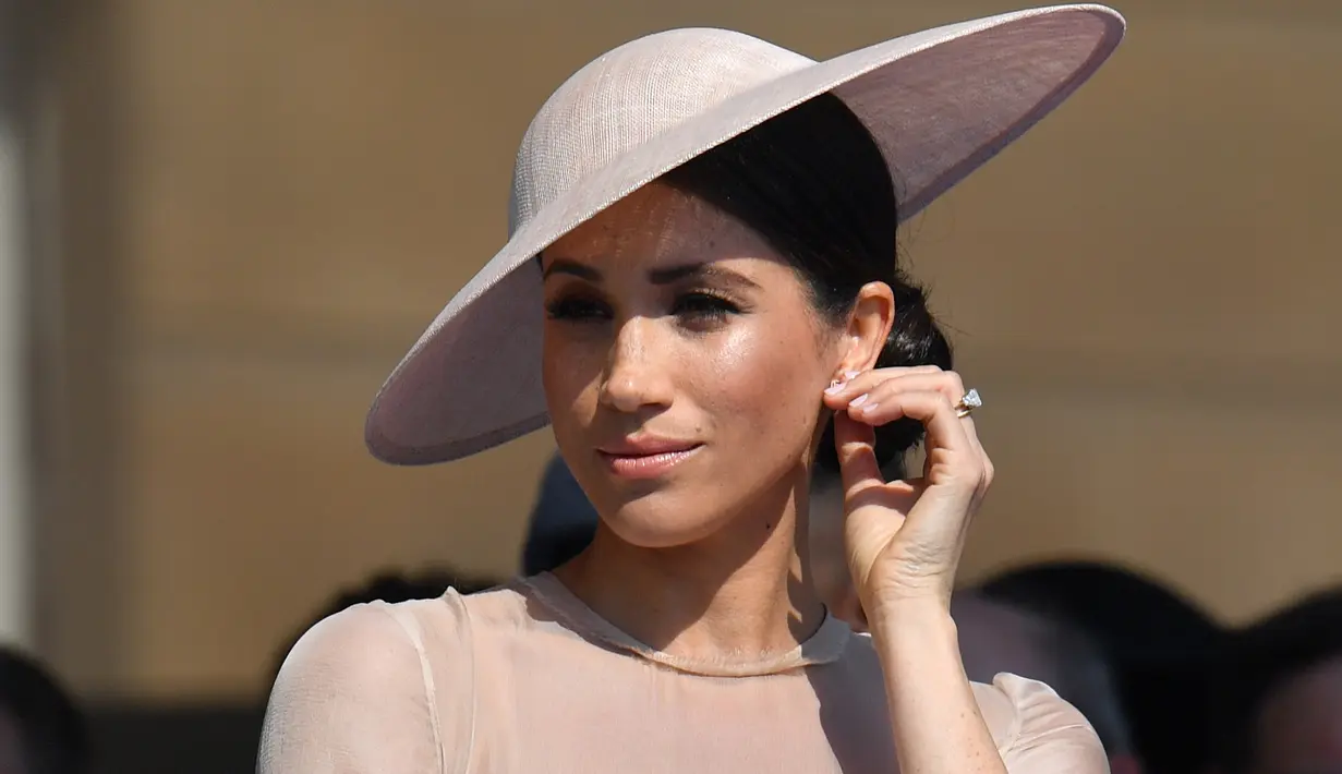 Meghan Markle kini miliki masalah dalam menaruh kepercayaan pada orang-orang terdekatnya. (DOMINIC LIPINSKI / POOL / AFP)