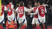 Pemain Arsenal, Ethan Nwaneri merayakan gol kelima timnya ke gawang Manchester City dalam laga lanjutan Liga Inggris 2024/2025 di Emirates Stadium, London, Minggu (03/02/2025). (AP Photo/Alastair Grant)