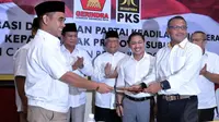 Penyerahan tanda kesepakatan oleh Sekejan Gerinda Ahmad Muzani (kiri) dan Sekjen PKS Taufik Ridho, Sabtu (17/5/2014) (liputan6.com/Johan Tallo)