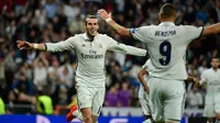 Gelandang Real Madrid, Gareth Bale melakukan selebrasi usai mencetak gol kegawang Legia Warsawa pada Liga Champion di stadion Santiago Bernabeu, Spanyol, (18/10). Madrid menang telak atas Legia dengan skor 5-1. (AFP Photo/Pierre-Philippe Marcou)