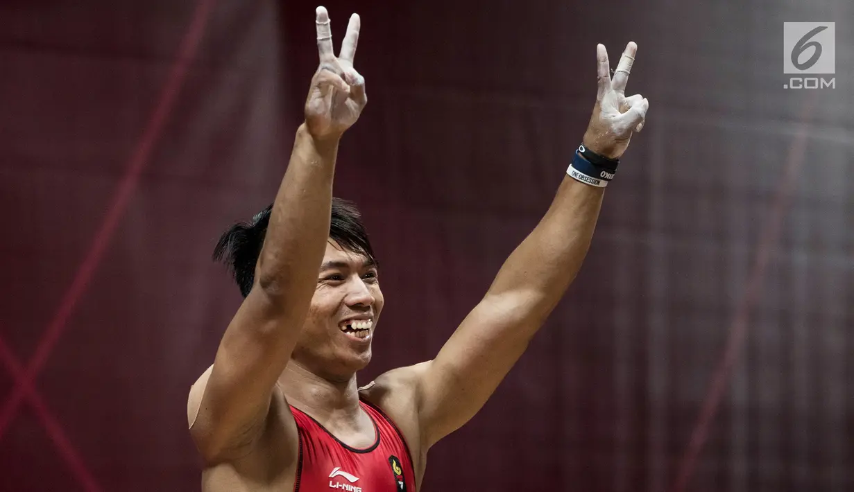 Lifter Indonesia, Deni saat berlaga pada Asian Games 2018 di JIExpo, Jakarta, Rabu (22/8). Deni berpeluang mendapatkan medali dan menambah pundi-pundi medali bagi Indonesia di Asian Games 2018. (Bola.com/Vitalis Yogi Trisna)
