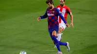 Gerard Pique saat tampil memperkuat Barcelona melawan Espanyol dalam lanjutan La Liga Spanyol, Kamis (9/7/2020).  (Pau Barrena/AFP).