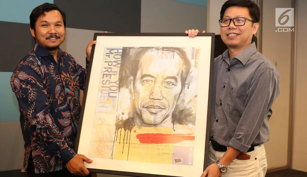 Sebuah lukisan bergambar Jokowi berhasil dilelang kepada Katadata dalam acara “Refleksi Kebebasan Pers dan Malam Penggalangan Dana” di Studio SCTV, Jakarta, Rabu (1/7). Lukisan tersebut dilelang dengan harga Rp 25 juta. (Liputan6.com/Immanuel Antonius)
