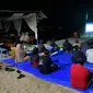 AJI Ajak Warga Pesisir Gorontalo Nobar Film Angin Timur Karya Ekspedisi Indonesia Baru (Arfandi/Liputan6.com)