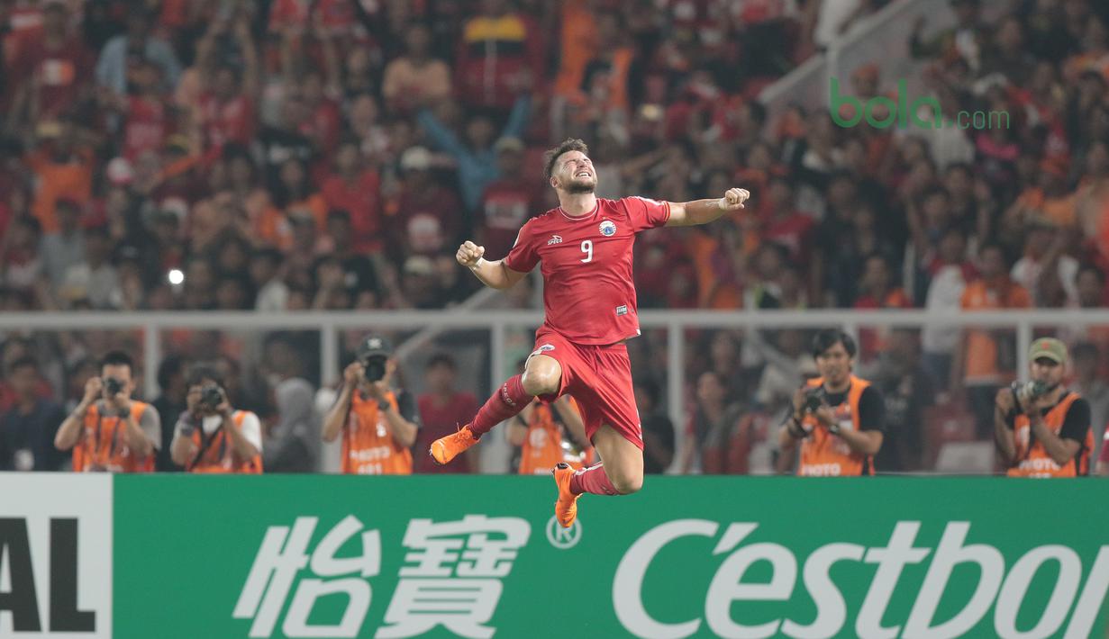 Gaya Marko Simic merayakan golnya ke gawang Tampines Rovers pada laga Piala AFC 2018 di Stadion Utama GBK, Senayan, Jakarta (28/2/2018). Persija menang 4-1. (Bola.com/Nick Hanoatubun)