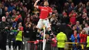 Bek Manchester United, Alex Telles berselebrasi usai mencetak gol ke gawang Villarreal pada pertandingan grup F Liga Champions di stadion Old Trafford, Inggris, Kamis (30/9/2021). Kemenangan atas Villarreal membuat MU berada di posisi kedua klasemen dengan empat tiga poin. (AFP/Anthony Devlin)