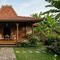 Rumah Joglo Sederhana dengan Teras dan Taman (created by AI)