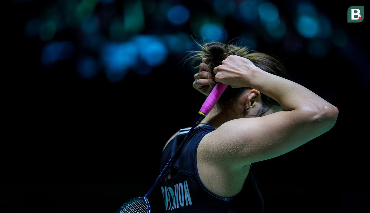 <p>Pebulu tangkis tunggal putri Thailand, Ratchanok Intanon mengikat rambutnya dalam laga final Indonesia masters 2025 melawan wakil Korea Selatan, Sim Yu-jin di Istora Senayan, Jakarta, Minggu (26/01/2025). (Bola.com/Bagaskara Lazuardi)</p>