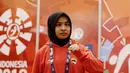 Atlet Judo Indonesia, Miftahul Jannah, berpose usai gagal berlaga pada Asian Para Games di Jiexpo, Kemayoran, Jakarta, Senin (8/10/2018). Miftah didiskualifikasi karena enggan melepas hijab nya. (Bola.com/M Iqbal Ichsan)