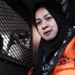 Evy Susanti usai diperiksa KPK, Jakarta, Rabu (5/8/2105). Gatot dan Evy menjalani pemeriksaan perdana usai menjadi tahanan KPK sebagai saksi untuk tersangka OC Kaligis dalam kasus suap hakim PTUN Medan. (Liputan6.com/Helmi Afandi)