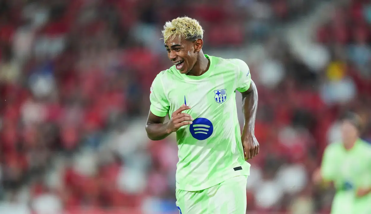 Barcelona memulai musim La Liga 2025/2026 dengan performa mengesankan. Blaugrana meraih kemenangan meyakinkan 3-0 saat berkunjung ke kandang Real Mallorca di Stadion Son Moix pada Minggu (17/8/2025) dini hari WIB. (AP Photo/Joan Mateu Parra)