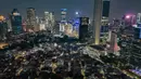 Menurut Pramono Anung, lewat integrasi CCTV, Pemerintah Provinsi Jakarta dapat memantau situasi kota secara lebih cepat dan efektif, di antaranya penanganan darurat, kriminalitas, hingga manajemen lalu lintas. Tampak foto udara memperlihatkan suasana malam gedung-gedung bertingkat di kawasan Sudirman, Jakarta, Selasa (7/4/2026). (merdeka.com/Arie Basuki)