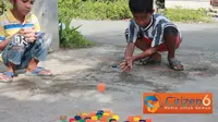 Guli Tutup Botol, Permainan Seru Mengisi Liburan Sekolah