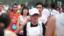 Ekspresi sejumlah pelari saat mencapai garis finis Jakarta Marathon 2018 di Gelora Bung Karno, Jakarta, Minggu (28/10). 12.500 pelari meramaikan Jakarta Marathon 2018 yang di sponsori PLN. (Liputan6.com/Faizal Fanani)