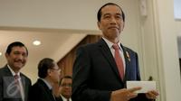 Presiden Jokowi saat memberikan pidato di Bandara Halim Perdanakusuma, Jakarta Timur, Rabu (2/12). (Liputan6.com/Faizal Fanani)