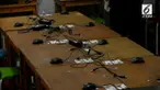 Ujian nasional berbasis komputer (UNBK) sltp terganggu karena 19 unit komputer dicuri. Polisi  melakukan olah TKP memeriksa saksi dan mengumpulkan barang bukti