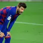 Ekspresi bek Barcelona, Gerard Pique, pada laga melawan Espanyol, di Camp Nou, Kamis (9/7/2020) dini hari WIB. (AFP/Lluis Gene)