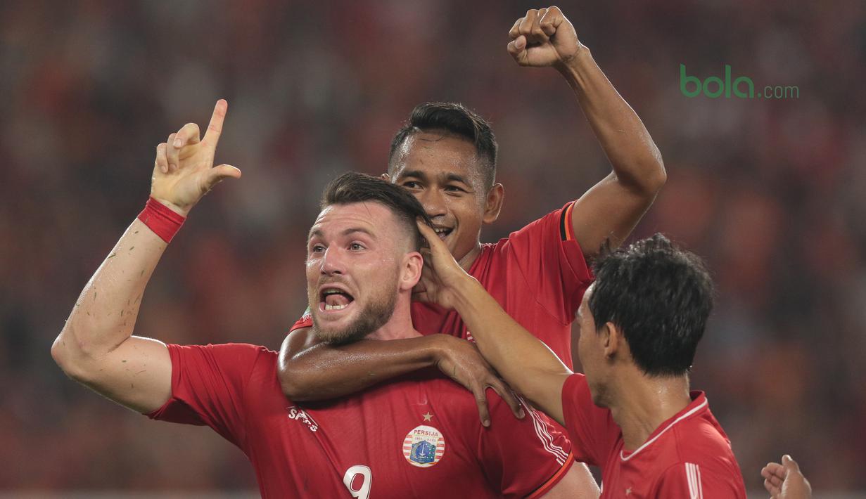 Pemain Persija Jakarta, Marko Simic merayakan gol ke gawang JDT pada laga Piala AFC 2018 di Stadion Utama Gelora Bung Karno, Jakarta, Selasa (10/4/2018). Persija Jakarta menang 4-0.  (Bola.com/Nick Hanoatubun)