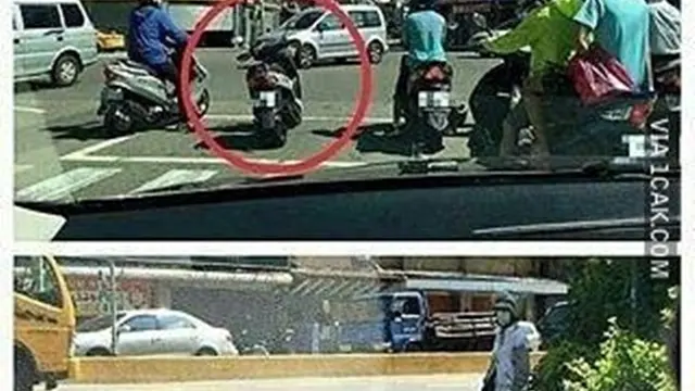 aksi pengendara motor di lampu merah (foto: 1CAK.com)