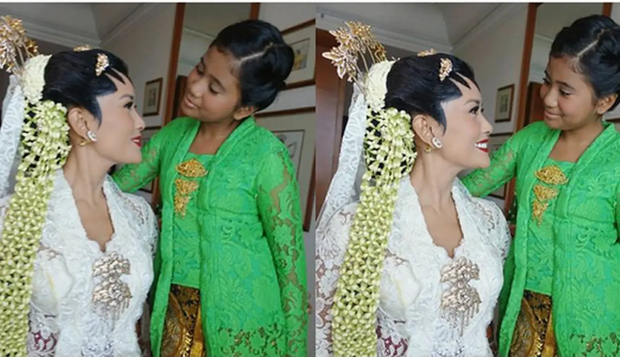 Titi melepas status janda. Pernikahan Titi Rajo Bintang dan Adrianto DJokosoetono di gelar secara tertutup di kediaman orangtua pengantin pria di kawasan Kebayoran Baru, Sabtu, 12 November 2016. (Instagram/bumiauw)