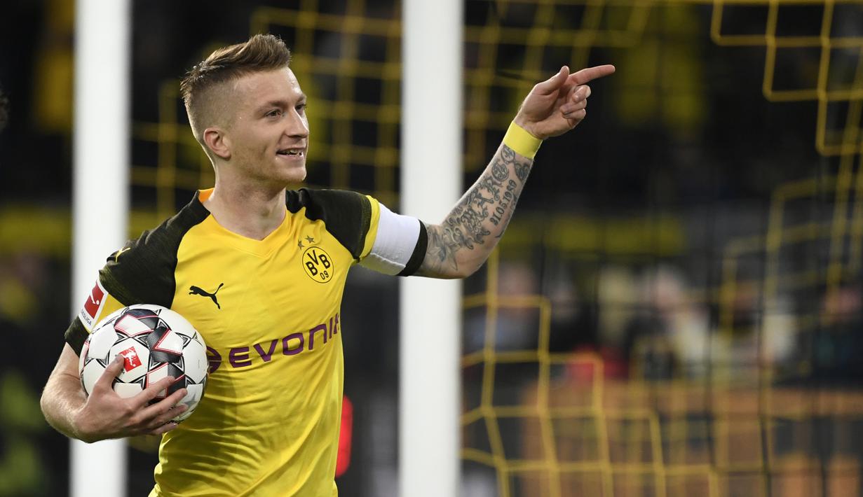 Marco Reus (Dortmund) - Reus baru tampil 19 kali bersama Dortmund di musim ini. Namun, pemain berusia 30 tahun ini telah menyumbangkan 11 gol untuk Dortmund di kompetisi Bundesliga 2019/20. (AFP/Ina Fassbender)