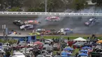 Sejumlah mobil saling bertabrakan pada lap ke-14 balapan NASCAR Daytona 500 di Daytona International Speedway, Pantai Daytona, Florida, Amerika Serikat, Minggu (14/2/2021). Sebanyak 16 mobil bertumpuk dalam kecelakaan tersebut. (AP Photo/Chris O'Meara)