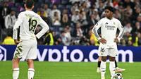 Kalah 1-2 pada leg kedua perempat final Liga Champions 2024/2025 memastikan Los Blancos tersingkir dari kompetisi Liga Champions 2024/2025. (JAVIER SORIANO/AFP)