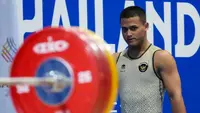 Rizki Juniansyah saat meraih medali emas di ajang SEA Games 2025. (NOC Indonesia)