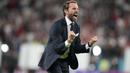 Gareth Southgate merupakan mantan pemain Crystal Palace, Aston Villa, dan Middlesbrough. Dirinya ditunjuk sebagai juru taktik Timnas Inggris pada tahun 2016 silam dan sukses mengantarkan The Three Lions menembus partai semifinal Piala Dunia 2018 dan final Euro 2020. (Foto: AFP/Pool/Frank Augstein)
