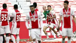 Pemain Ajax Amsterdam, Antony Matheus Dos Santos dan David Neres, melakukan selebrasi usai memastikan diri meraih gelar juara Liga Belanda usai mencukur Emmen 4-0 dalam laga pekan ke-31 di Stadion Johan Cruijff Arena, Minggu (2/5/2021). (AFP/Maurice Va Steen)