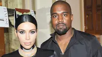 Kim Kardashian dan Kanye West. (foto: usmagazine)