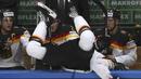 Pemain Ice Hockey Jerman, Korbinian Holzer terlempar keluar arena saat berebut bola dengan pemain Rusia pada kejuaraan IIHF World Championship 2016 di Moscow, Rusia, (19/5/2016). (REUTERS/Grigory Dukor) 