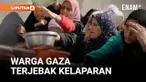 Puluhan warga Palestina berkumpul di Nuseirat, Gaza Tengah, Rabu, sambil membawa panci dan wajan untuk mendapatkan makanan dari salah satu dari dua dapur amal yang masih beroperasi di wilayah tersebut.