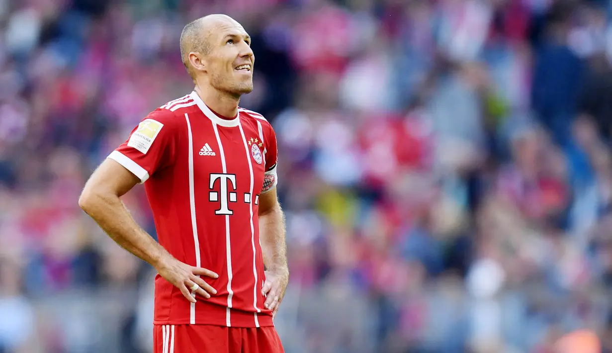 Arjen Robben - Mantan bintang Timnas Belanda ini punya catatan baik saat ditangani dua pelatih hebat ini. Pemain berkaki kidal itu mampu meraih gelar untuk Bayer Munchen bersama Pep Guardiola dan Chelsea bersama Jose Mourinho. (AFP/Christof Stache)