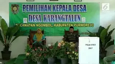 Sepasang suami istri maju dalam pemilihan kepala desa di Purworejo, Jawa Tengah.