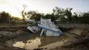 Pemandangan sebuah rumah yang hanyut oleh Badai Fiona di Villa Esperanza di Salinas, Puerto Rico, Rabu, 21 September 2022. Menurut para pejabat di Puerto Rico, badai tropis fional juga menyebabkan sekitar 196.000 orang kehilangan air minum akibat pemadaman listrik dan banjir sungai. (AP Photo/Alejandro Granadillo)