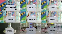Foto gabungan tenaga medis saat memegang kertas bertuliskan “Idul Fitri" di RSUD Pasar Minggu, Jakarta, Jumat (22/5/2020). Sejumlah garda terdepan Covid-19 menyampaikan pesan sebuah tulisan. (Liputan6.com/Herman Zakharia)