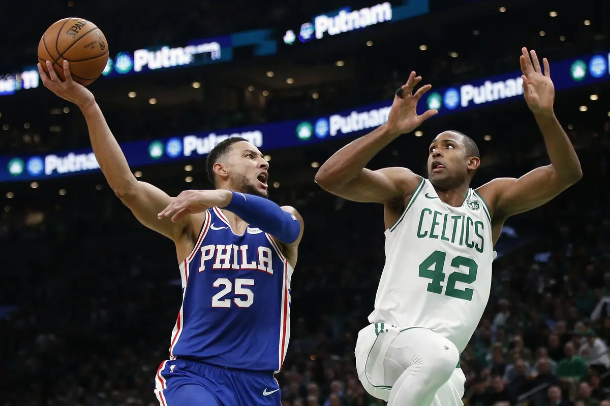 Aksi Ben Simmons (no 25) menghadapi Al Horford (AP)