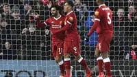 Winger Liverpool, Mohamed Salah merayakan gol ke gawang Watford pada laga pekan ke-31 Premier League 2017-2018 di Stadion Anfield, Minggu (18/3/2018) dini hari WIB. (Anthony Devlin/PA via AP)